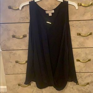 Black free flowing sleeveless blouse